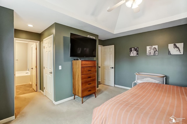 carpeted bedroom with lofted ceiling, connected bathroom, and ceiling fan