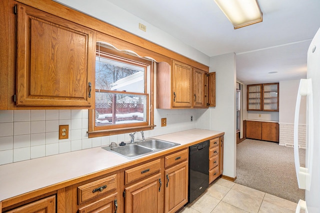 kitchen with sink, tasteful backsplash, dishwasher, white fridge, and light colored carpet