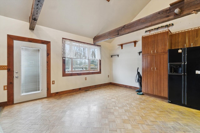 interior space with black fridge with ice dispenser, light parquet floors, and vaulted ceiling with beams