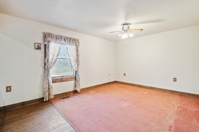 spare room featuring ceiling fan and wood-type flooring