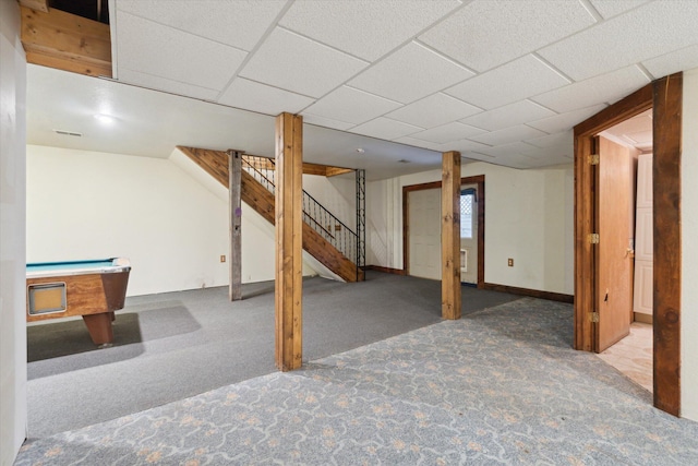 basement with a paneled ceiling, billiards, and carpet