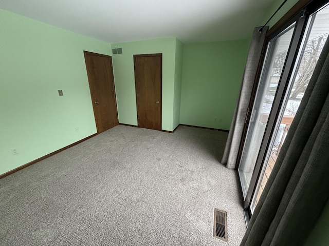 unfurnished bedroom with a closet and carpet