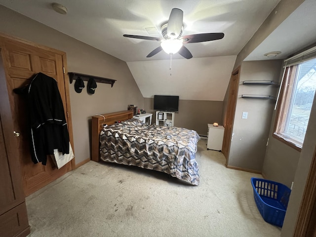 carpeted bedroom featuring lofted ceiling and ceiling fan