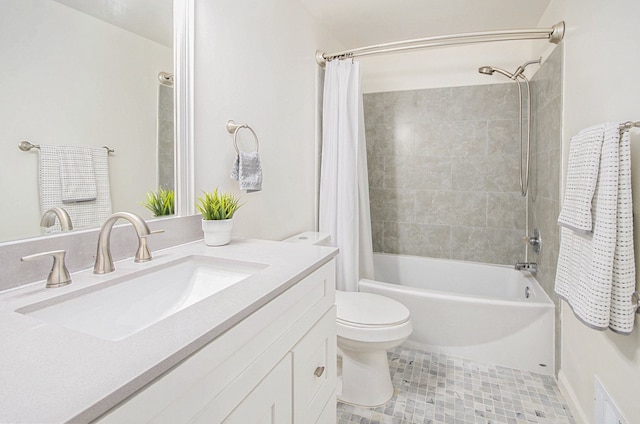 full bathroom featuring shower / tub combo with curtain, vanity, tile patterned flooring, and toilet