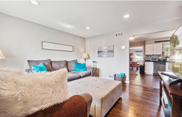 living room with dark wood-type flooring