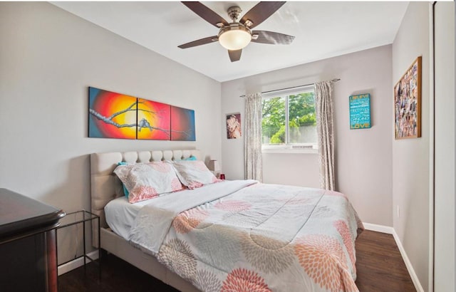 bedroom with dark wood-type flooring and ceiling fan