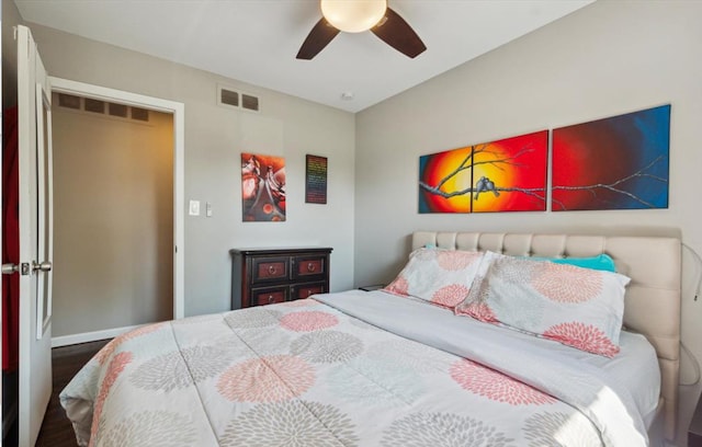 bedroom with hardwood / wood-style flooring and ceiling fan