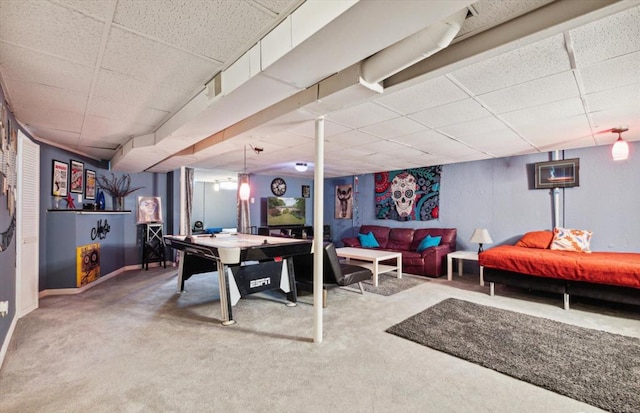 recreation room with carpet flooring and a drop ceiling