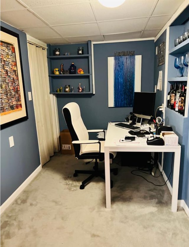 home office featuring a paneled ceiling and carpet floors