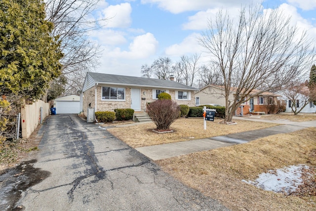 view of front of property with an outbuilding and a garage