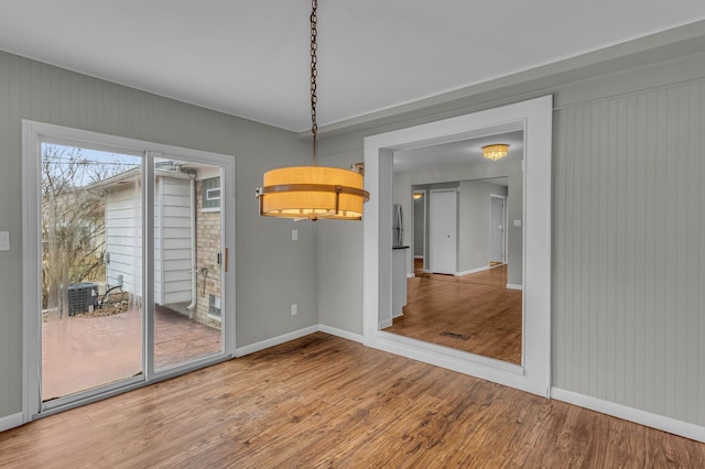 unfurnished dining area with hardwood / wood-style flooring