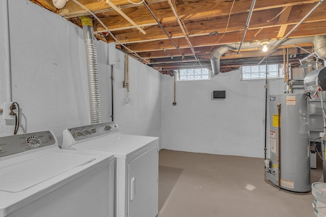 washroom featuring washing machine and dryer and water heater