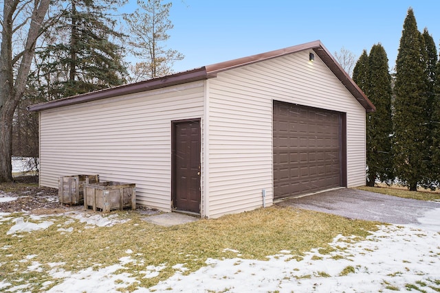 view of snow covered garage