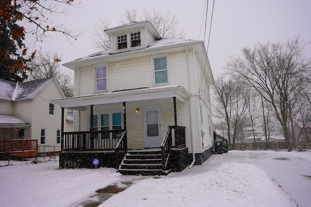 view of front of property featuring covered porch