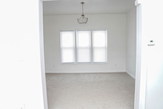 spare room with light carpet