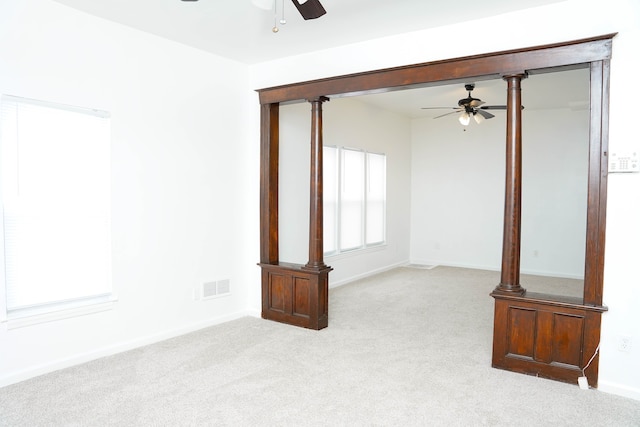 empty room with light carpet and ceiling fan