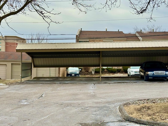 view of vehicle parking featuring a carport