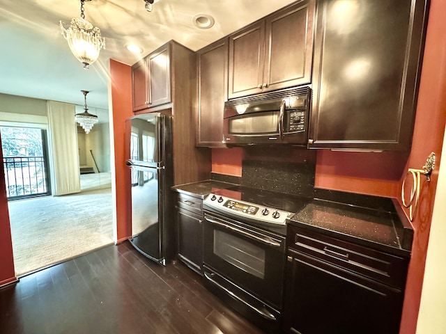 kitchen with decorative light fixtures, dark wood-type flooring, dark brown cabinetry, and black appliances