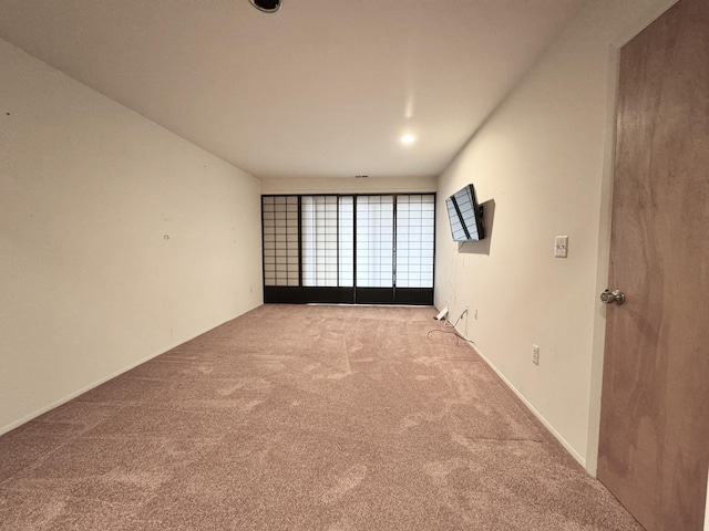 unfurnished room featuring carpet floors