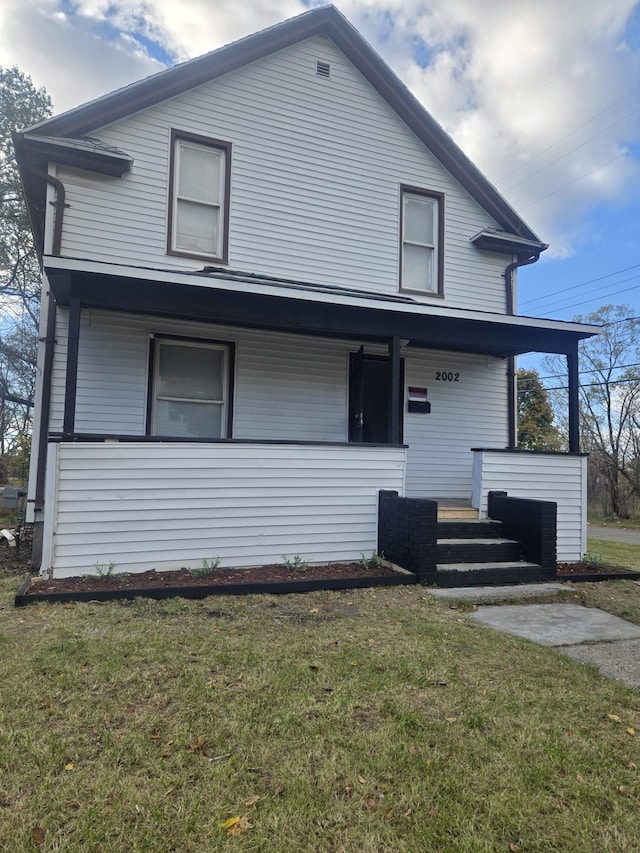 view of front facade featuring a porch and a front lawn