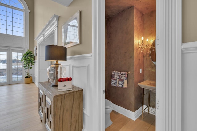 bathroom with hardwood / wood-style flooring