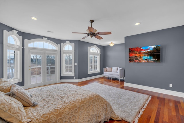 bedroom featuring ceiling fan, access to exterior, and hardwood / wood-style floors