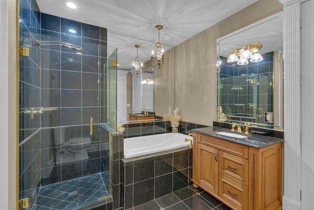 full bathroom featuring shower with separate bathtub, vanity, a notable chandelier, toilet, and tile patterned floors