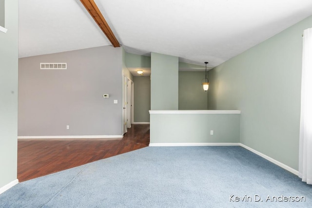 carpeted empty room featuring visible vents, vaulted ceiling with beams, and baseboards