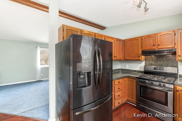 kitchen with backsplash, dark wood-type flooring, lofted ceiling with beams, and appliances with stainless steel finishes