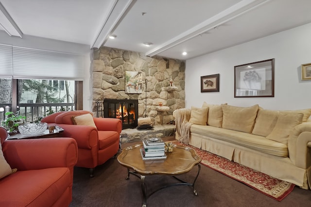 living room with beam ceiling and a fireplace