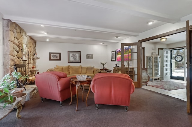 living room featuring beamed ceiling and dark carpet