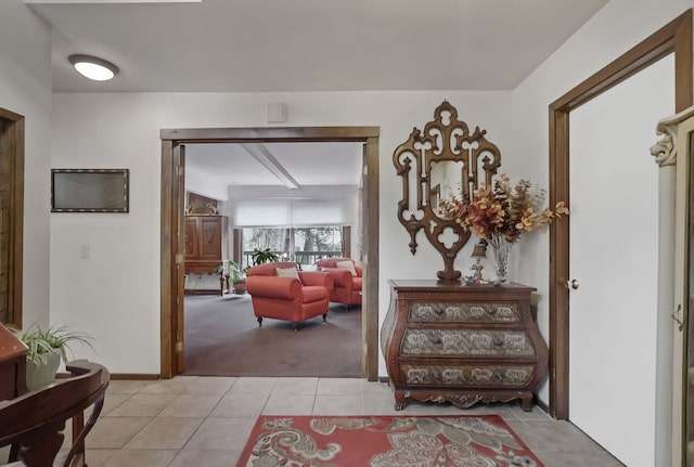 hall with light tile patterned floors