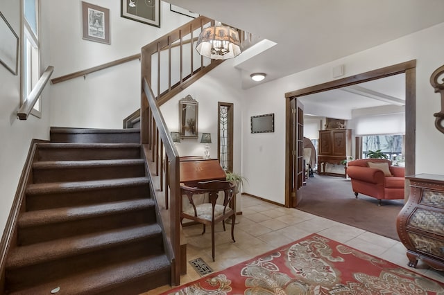 staircase with tile patterned floors