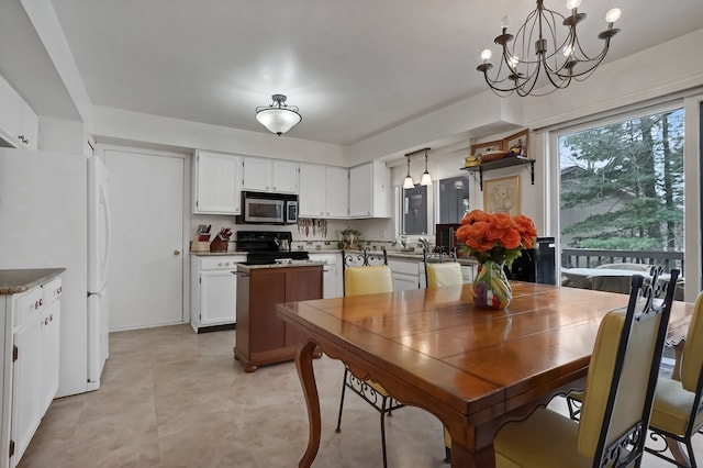 dining space featuring a chandelier