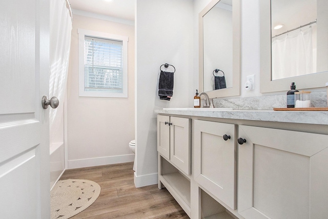 16715 Williamsville St, Vandalia, MI 49095 - full bathroom featuring vanity, hardwood / wood-style floors, shower / bath combination with curtain, and toilet