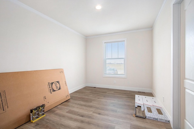 16715 Williamsville St, Vandalia, MI 49095 - unfurnished room with crown molding and light wood-type flooring