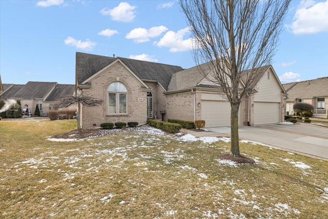 view of front of property featuring a garage and a front lawn