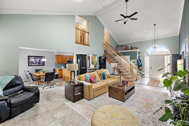 tiled living room featuring crown molding, high vaulted ceiling, and ceiling fan