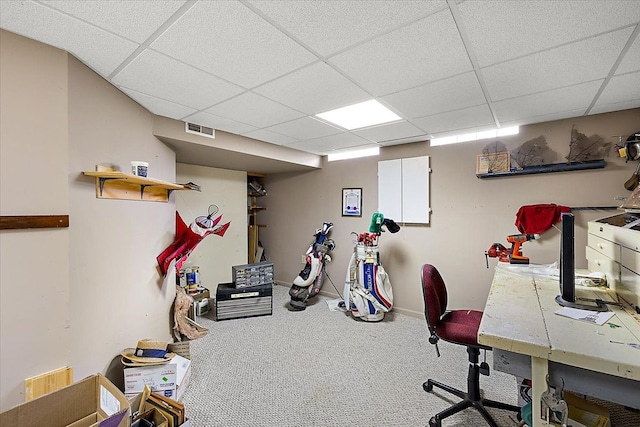 carpeted office space featuring a drop ceiling