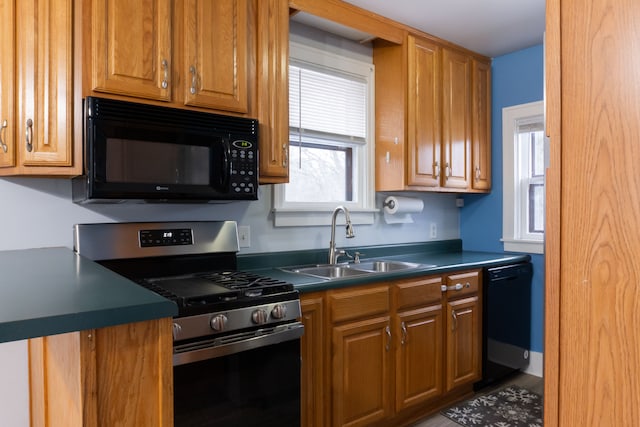 kitchen with sink and black appliances