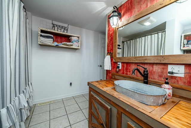 bathroom with tile patterned floors and vanity