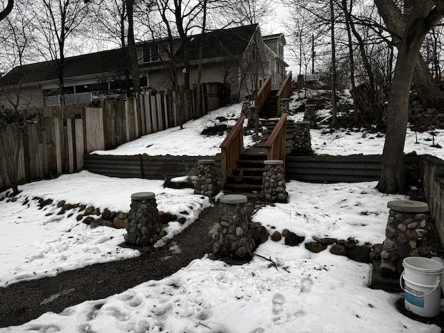 view of yard layered in snow