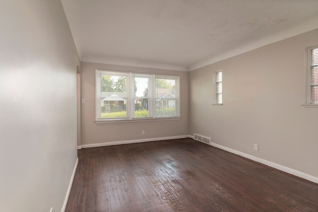 spare room with dark hardwood / wood-style flooring