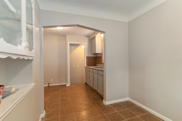 kitchen featuring sink and decorative backsplash