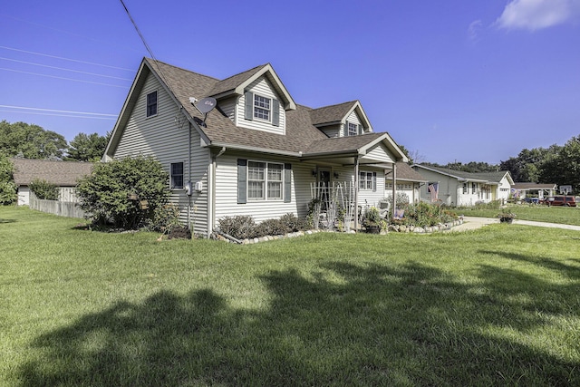 cape cod home featuring a front yard