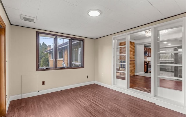 empty room featuring wood-type flooring