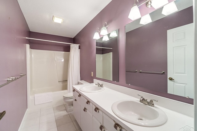 full bath featuring shower / bath combination with curtain, a sink, toilet, and tile patterned floors