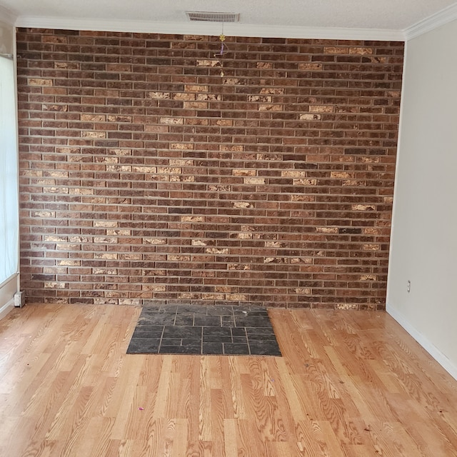 room details with ornamental molding and hardwood / wood-style floors