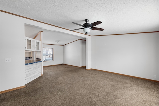 unfurnished living room with crown molding and a textured ceiling