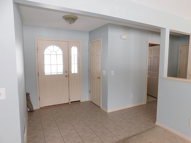 entrance foyer featuring light tile patterned floors